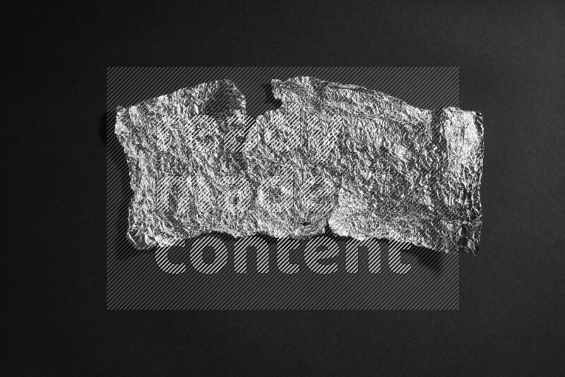 Aluminium foil on black background
