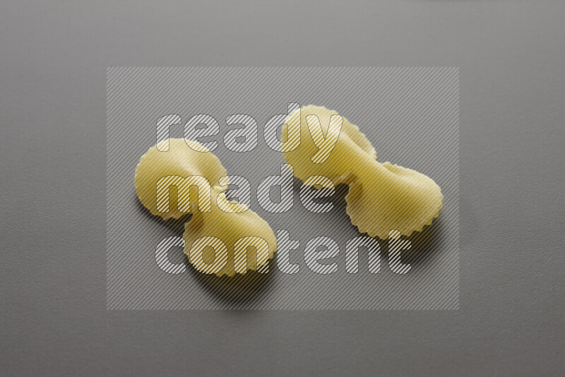 Fiocchi pasta on grey background
