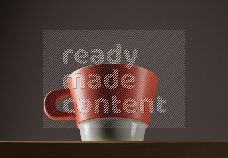 Low angle shot of a bicolor cup on grey background