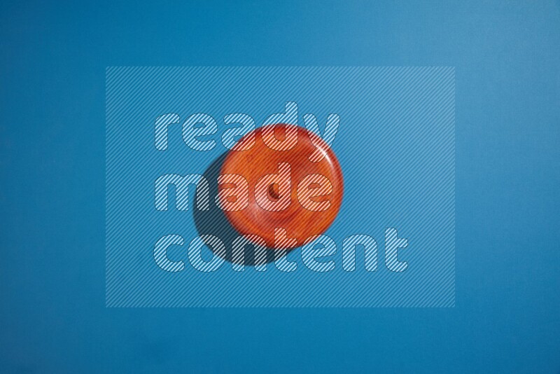 brown bowl on blue background