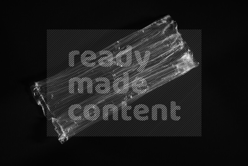 Transparent plastic textures on black background