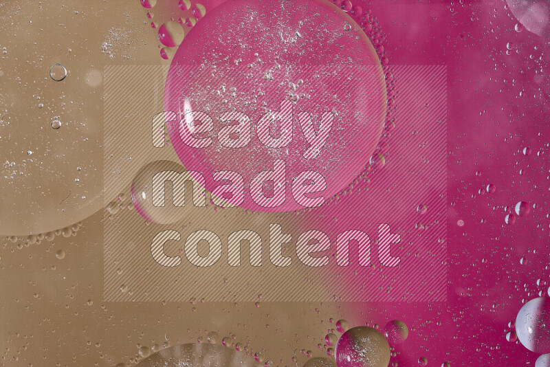 Close-ups of abstract oil bubbles on water surface in shades of pink and brown