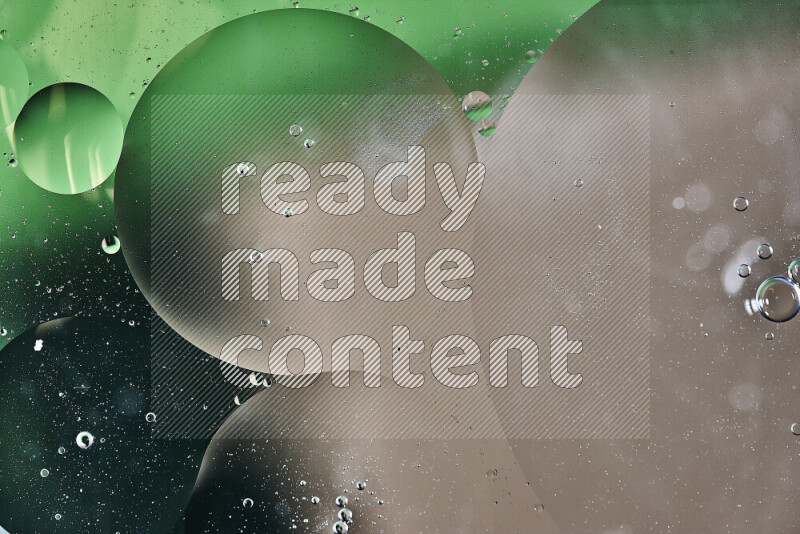 Close-ups of abstract oil bubbles on water surface in shades of green and brown