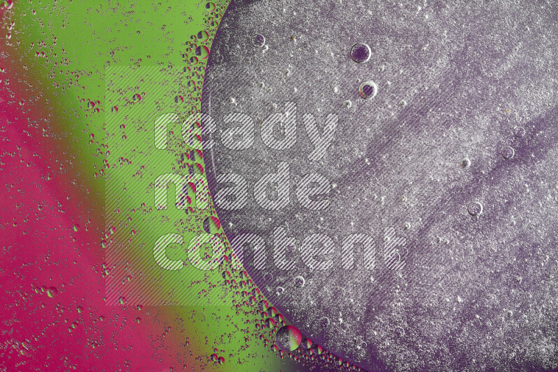 Close-ups of abstract oil bubbles on water surface in shades of purple, green and pink