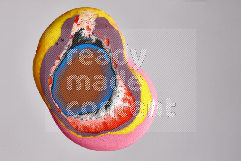 Close-ups of assorted colors blending on a grey background