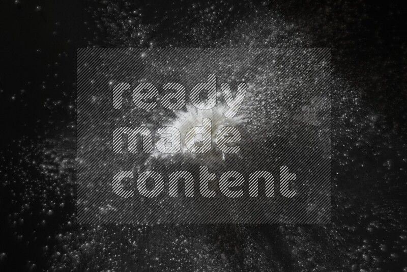 White powder explosion on black background