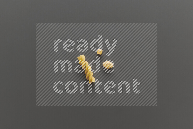 Different pasta types on grey background