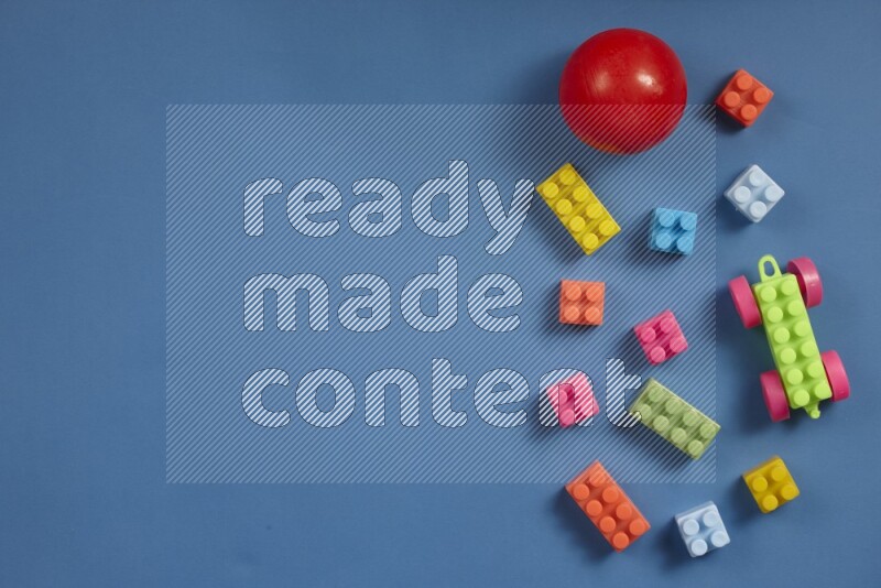 Plastic building blocks with balls on different colored background (kids toys)