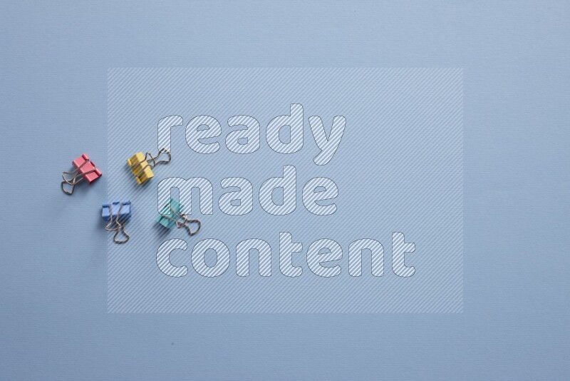 Different school supplies on blue background