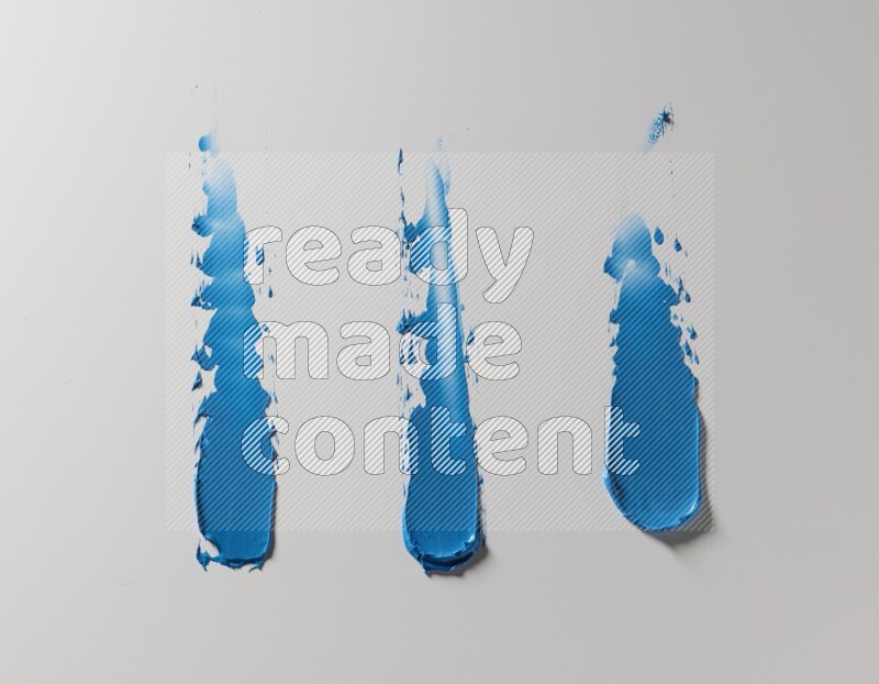 Blue painting knife strokes on white background