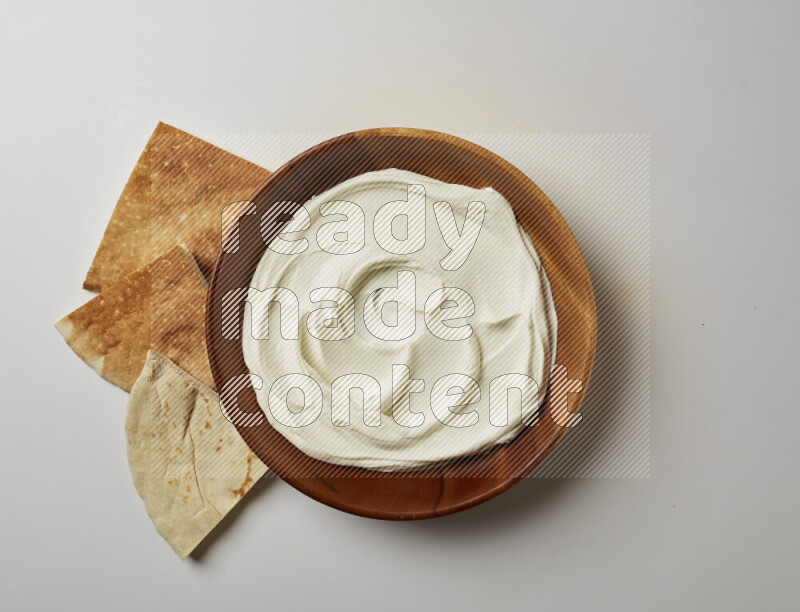 Plain Lebnah in a wooden plate on a white background