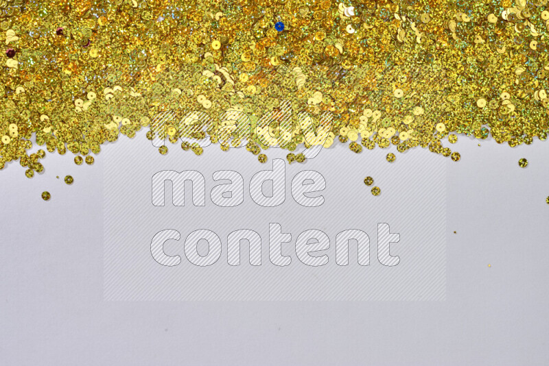 Multicolored flat sequins on grey background