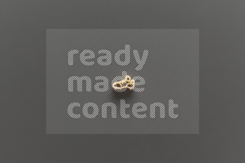 Shaped children pasta on grey background