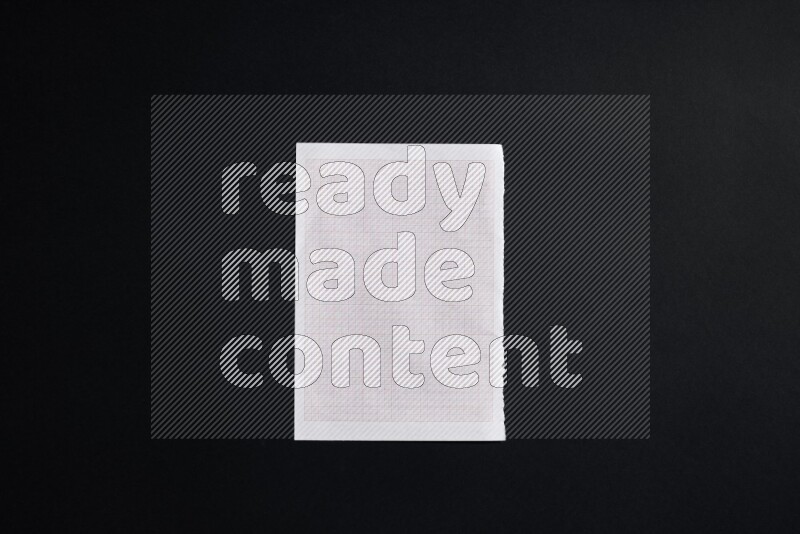 Notebook sheet on black background