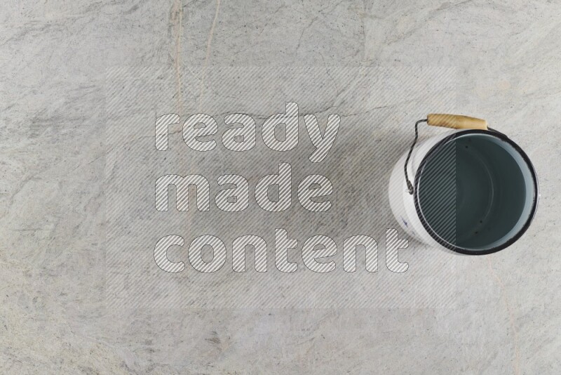 A vintage milk can on grey marble background
