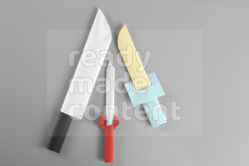 Origami sword on grey background