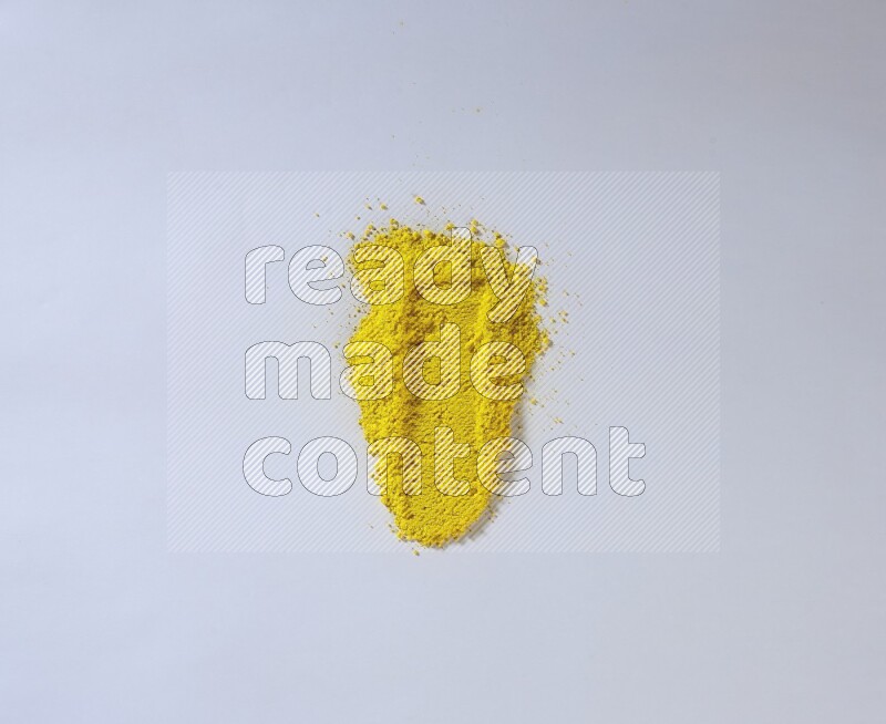 Yellow powder smears on white background