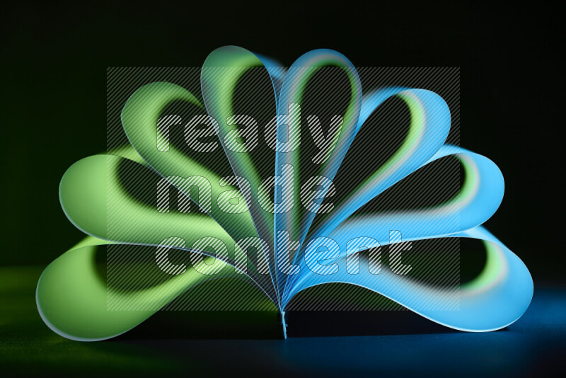 An abstract art piece displaying smooth curves in blue and green gradients created by colored light