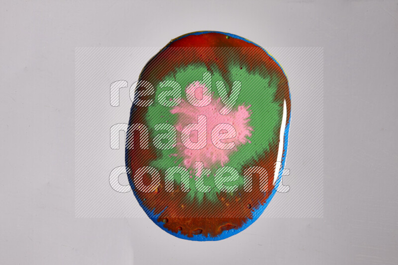 Close-ups of assorted colors blending on a grey background