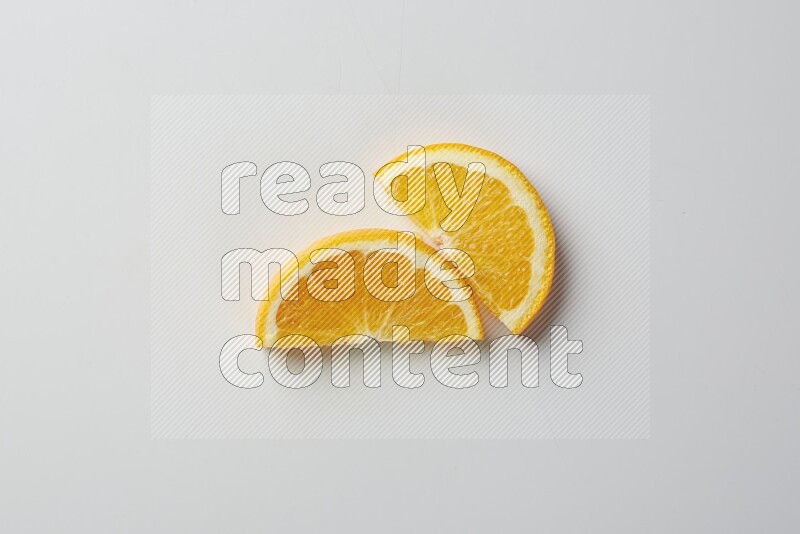 Two halves of an orange slices on white background
