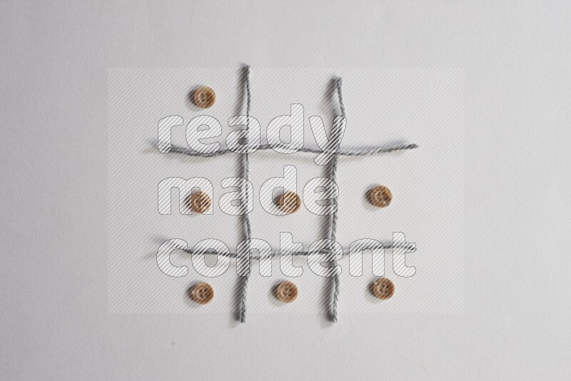 Brown buttons placed on grey background