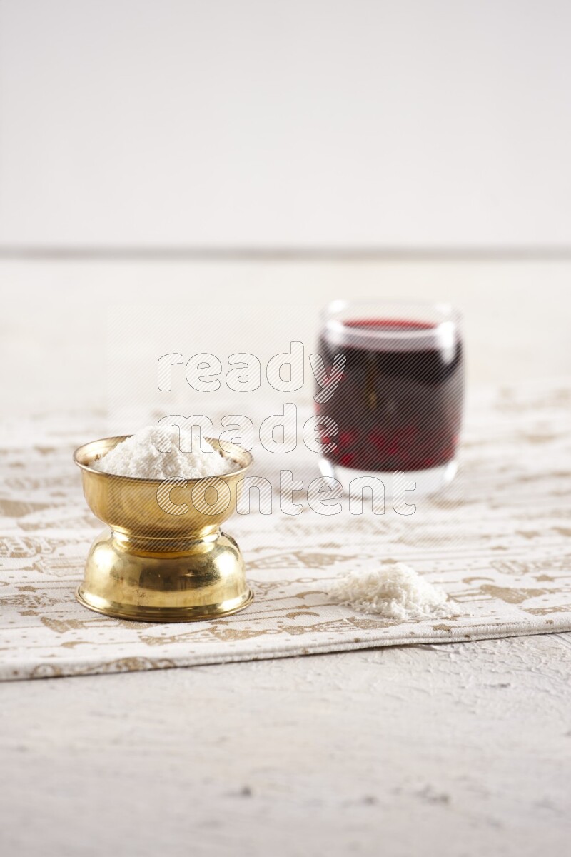 Dried fruits in a metal bowl with hibiscus in a light setup