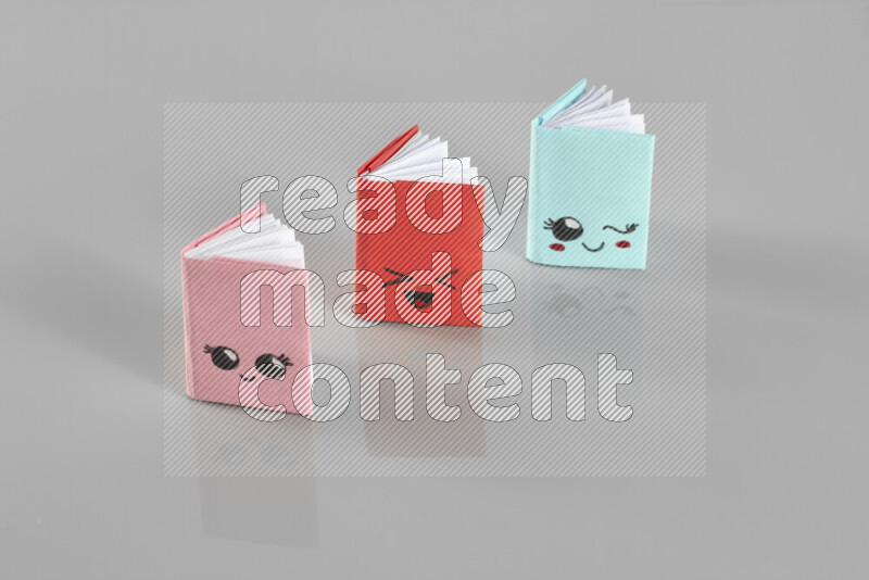 Origami book on grey background