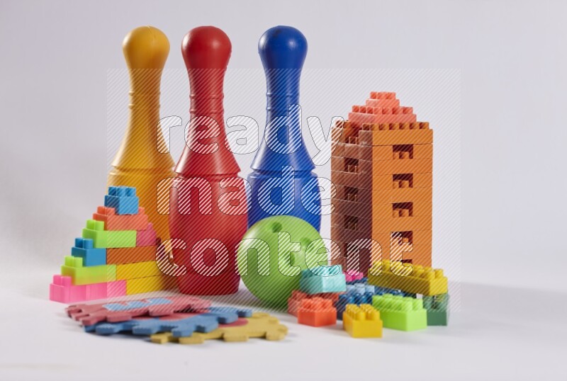 Collection of colorful different kids toys on white background