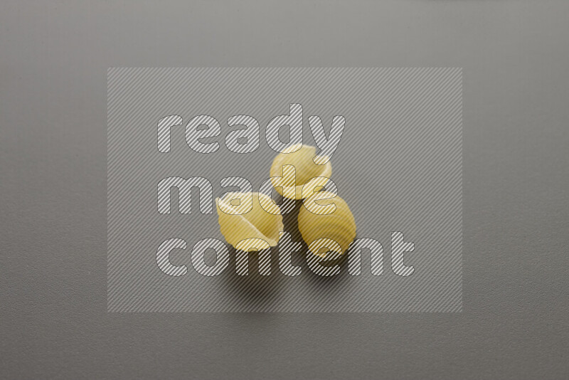 Shells pasta on grey background