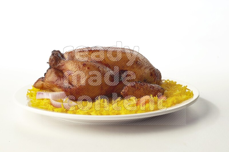 yellow  basmati Rice with  whole roasted chicken on a white rounded plate direct on white background