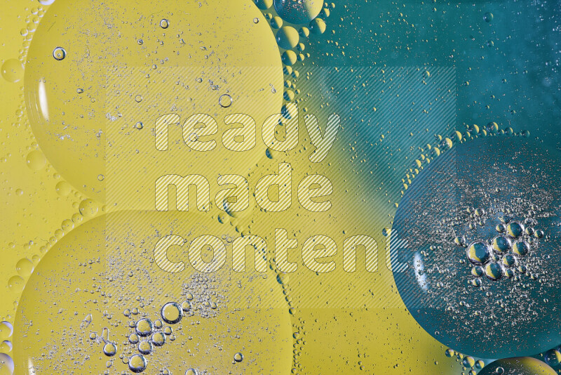 Close-ups of abstract oil bubbles on water surface in shades of green and yellow