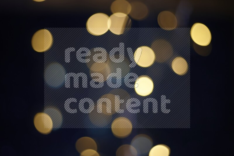 Bokeh light in yellow with blue background