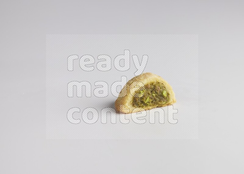 Half Maamoul filled with pistachio direct on white background