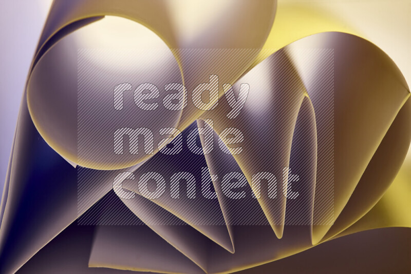 An artistic display of paper folds creating a harmonious blend of geometric shapes, highlighted by soft lighting in warm tones