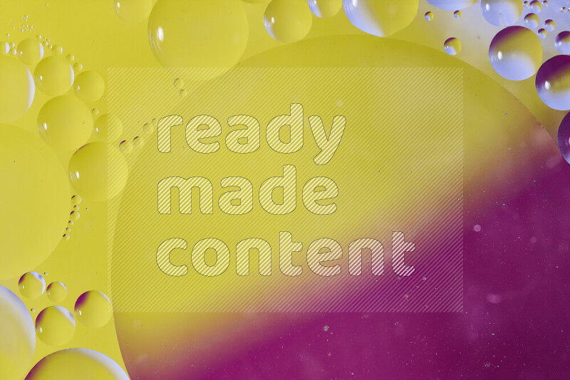 Close-ups of abstract oil bubbles on water surface in shades of yellow and pink