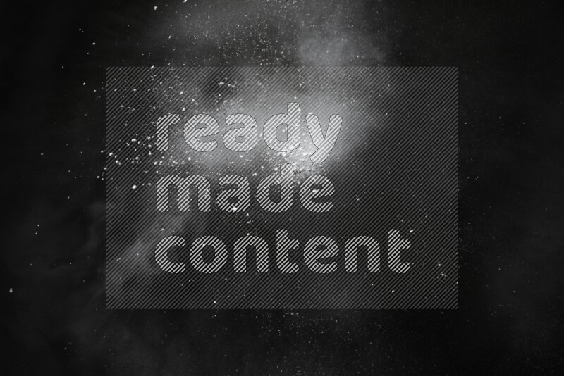 White powder explosion on black background
