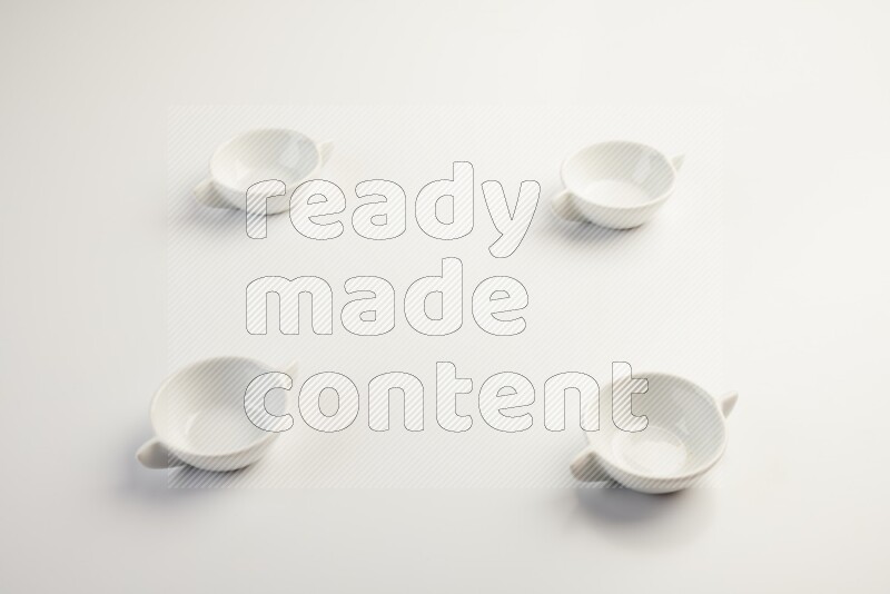 white ceramic round sauce dish on white countertop