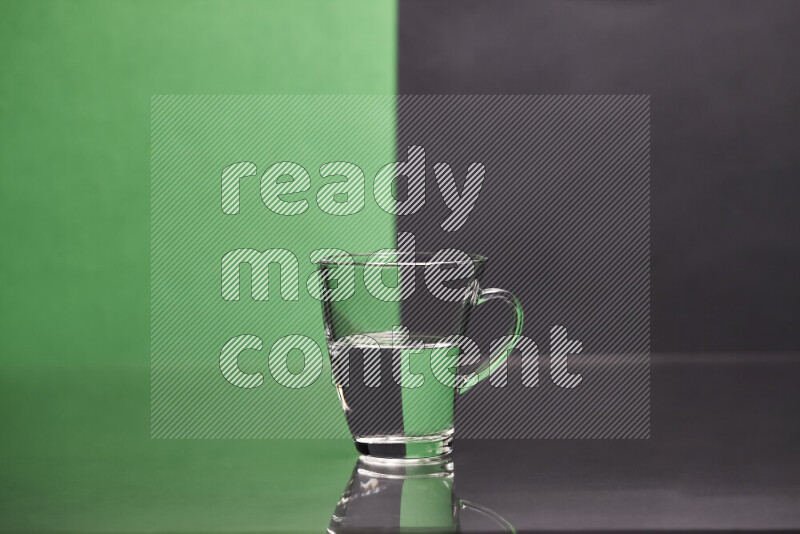 The image features a clear glassware filled with water, set against green and black background
