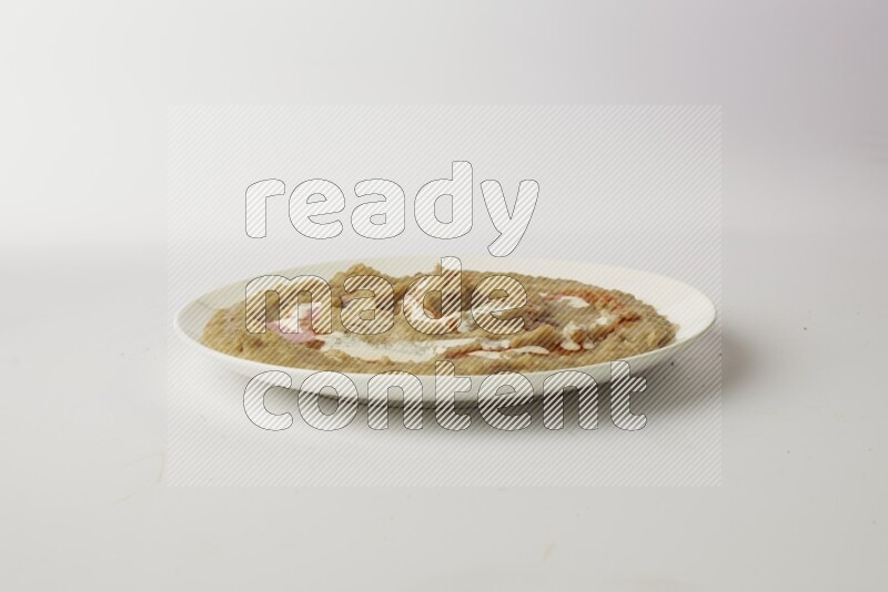fava bean in a white plate direct on a white background
