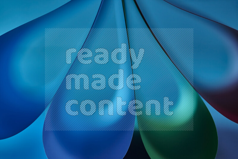 An abstract art piece displaying smooth curves in colorful gradients created by colored light