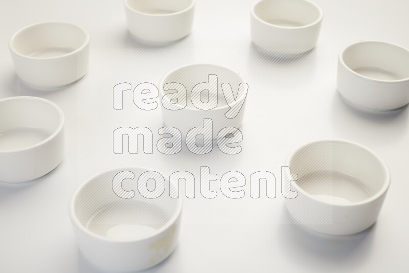 white ceramic round sauce dish on white countertop