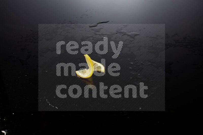 Lemon slice on black background