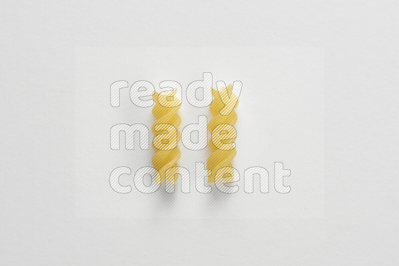 Fusilli pasta on white background