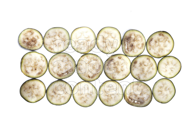 Eggplant slices on illuminated white background