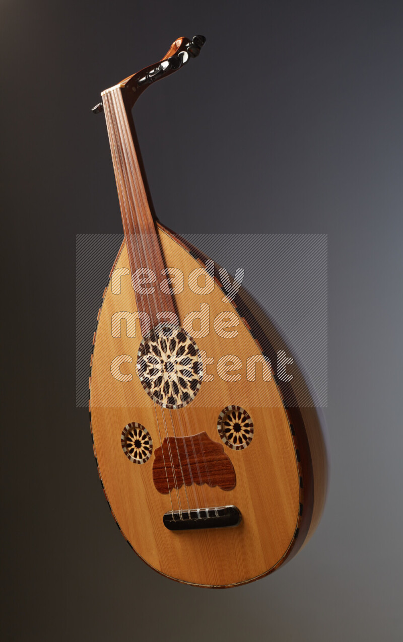 a wooden brown Oud on a gray background