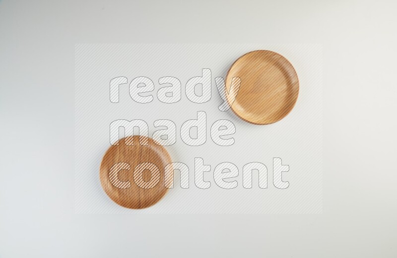 Wooden bowl and plate on white background