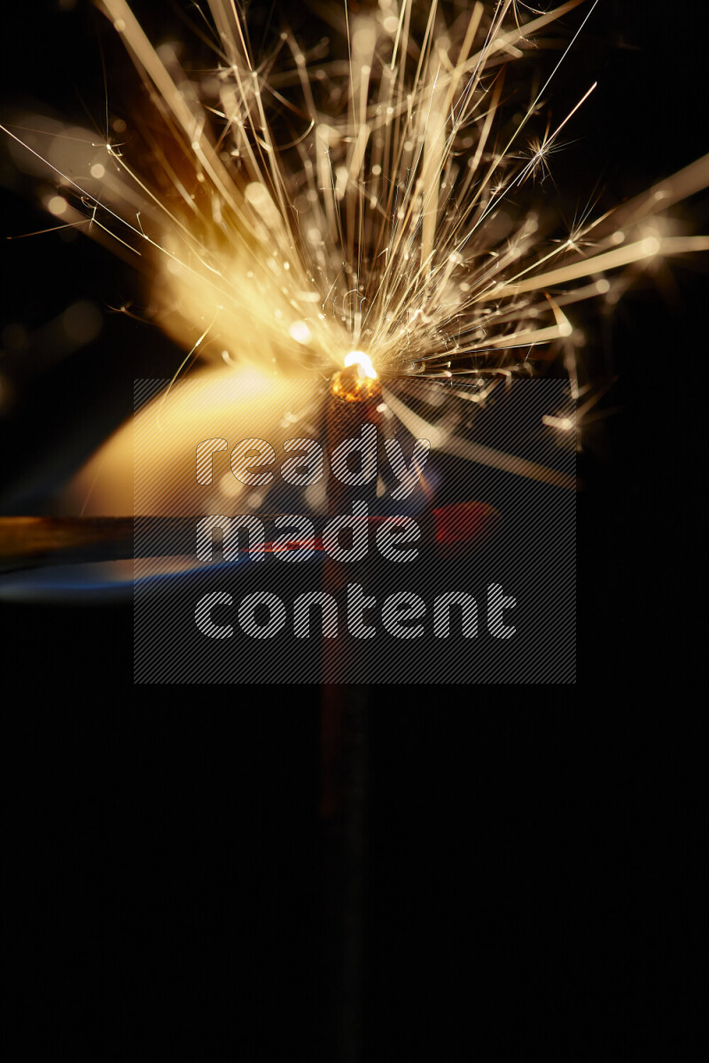 A close-up image of sparkler candle isolated on black background