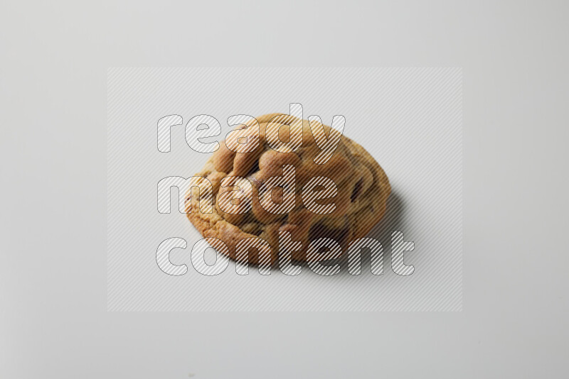 a chocolate chip cookie on a white background