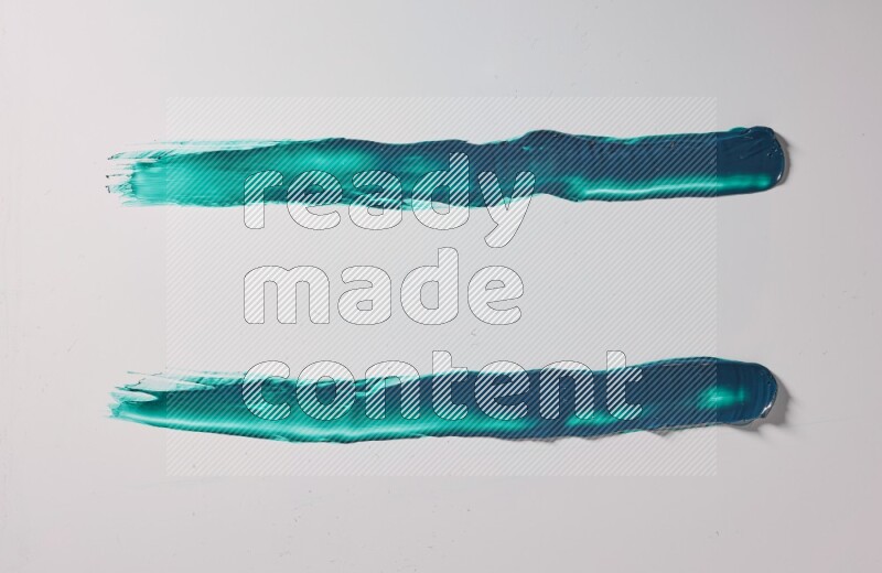 Turquoise painting knife strokes on white background