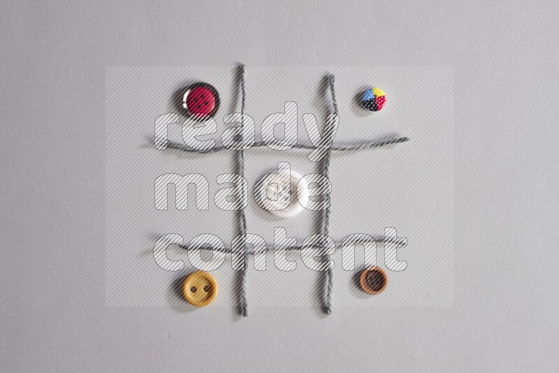 Multicolored buttons placed on grey background